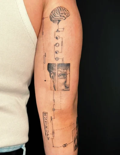 Tattoo aus St. Gallen an einem Oberarm im Finline Styl