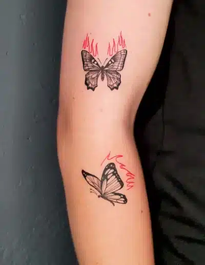 Brennende Schmetterlinge auf Arm Tattoo